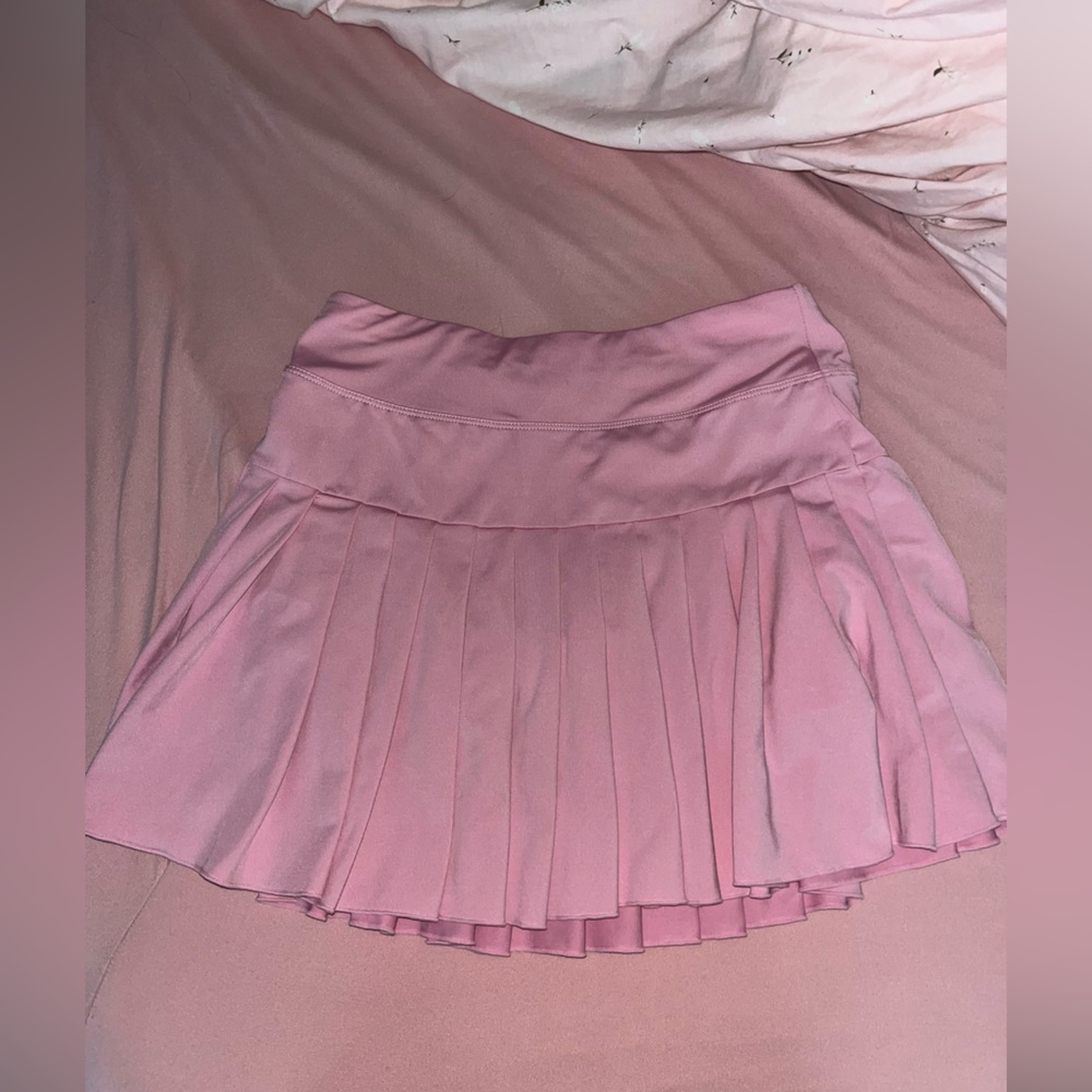 Pink tennis skirt with shorts underneath